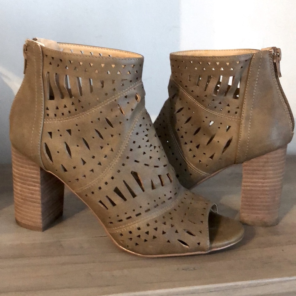 Restricted brown cutout peep toe ankle booties
